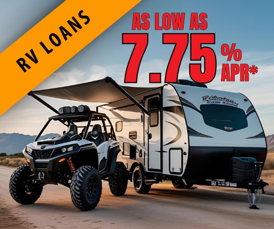 A white side by side parked next to a new trailer.