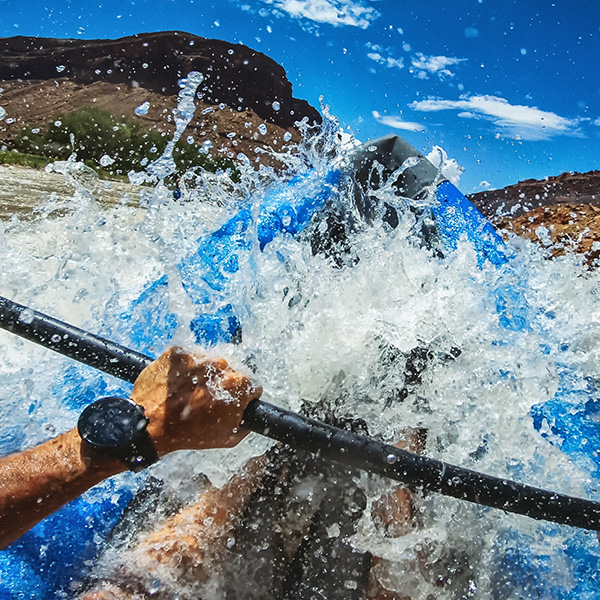 Kayaker blasting though the rapids.